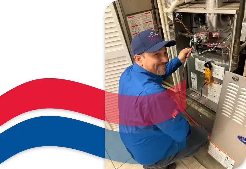 Sal's technician in a blue uniform servicing a furnace